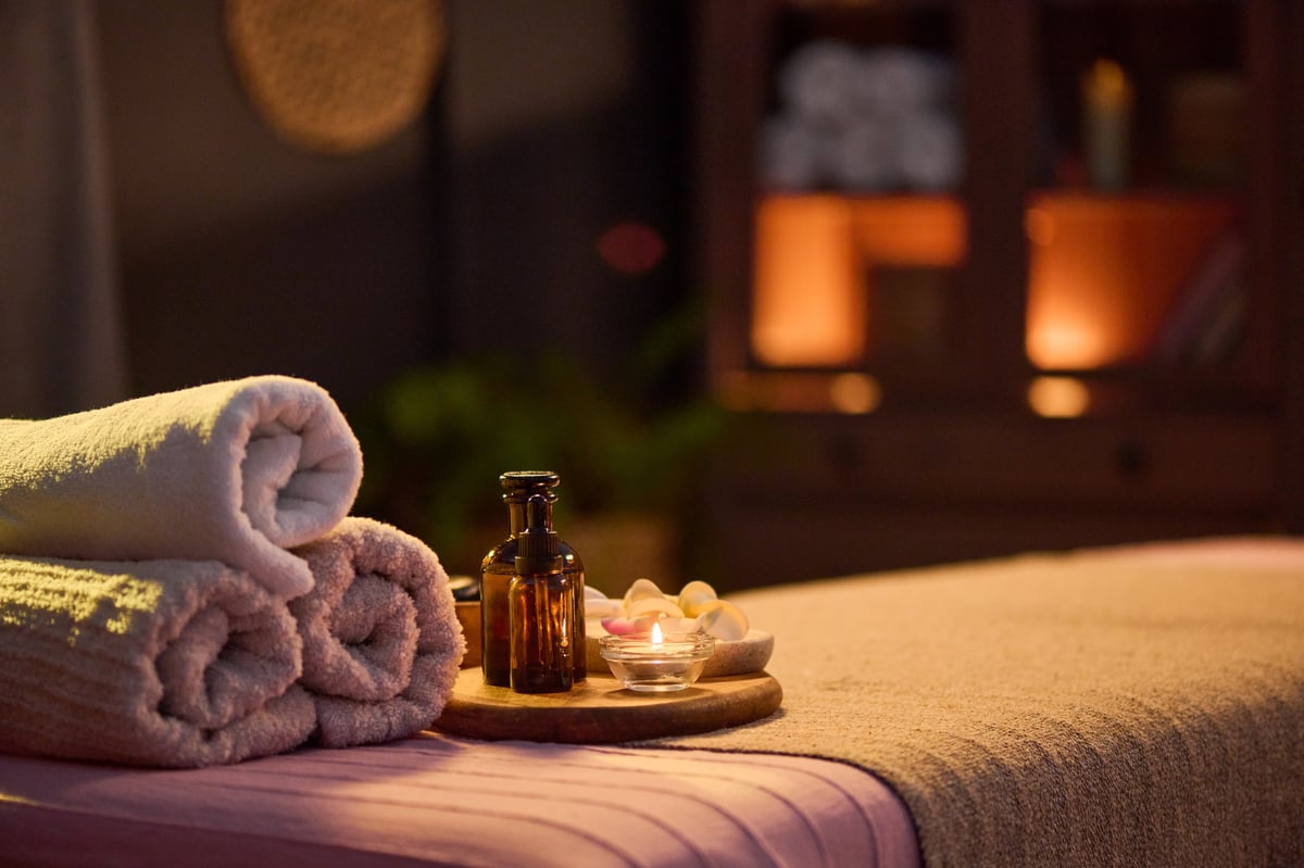 Professional mobile massage setup with massage table, towels, and aromatherapy — therapeutic massage brought to your home in Fort Walton Beach